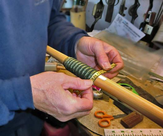 Man measuring longbow